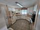 Functional kitchen featuring ample cabinet space, tiled floors, and essential appliances at 808 53Rd E Ave # 229, Bradenton, FL 34203