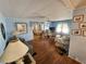 Comfortable living room featuring wood floors, plush seating, and natural light at 808 53Rd E Ave # 229, Bradenton, FL 34203