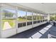 This screened-in lanai offers views of the landscaped yard, enhancing its appeal and serenity at 909 68Th W St, Bradenton, FL 34209
