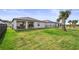 Spacious, grassy backyard with a view of the water; a perfect outdoor oasis at 9725 Last Light Gln, Parrish, FL 34219