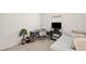 Bedroom with a daybed, a gray desk, office chair, and a green potted plant at 9725 Last Light Gln, Parrish, FL 34219
