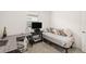 Bedroom featuring a daybed with decorative pillows, gray desk, and office chair at 9725 Last Light Gln, Parrish, FL 34219