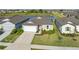 Charming single-Gathering home with a well-manicured lawn, lush landscaping, a two-car garage, and a pond view at 9725 Last Light Gln, Parrish, FL 34219