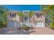 Charming two-story home with well-maintained landscaping and a welcoming entryway at 5024 Commonwealth Dr, Sarasota, FL 34242