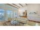Open-concept living room with large windows, hardwood floors, and stylish decor at 5024 Commonwealth Dr, Sarasota, FL 34242