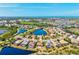 An aerial of beautiful homes with lush greenery, lakes and water views at 10816 O Meara Way, Englewood, FL 34223