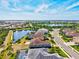 This aerial shot showcases the community's serene lake views and well-maintained streets at 10816 O Meara Way, Englewood, FL 34223