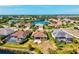 This aerial shot showcases the community's serene lake views and lush landscaping at 10816 O Meara Way, Englewood, FL 34223