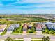 This aerial shot displays the community's serene lake views and lush landscaping at 10816 O Meara Way, Englewood, FL 34223