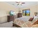 Inviting bedroom with a queen-size bed, offering a relaxing retreat with serene views at 10816 O Meara Way, Englewood, FL 34223