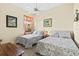Charming bedroom with two twin beds, offering a comfortable and inviting space at 10816 O Meara Way, Englewood, FL 34223