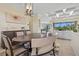 Formal dining area with stylish furnishings and plenty of natural light at 10816 O Meara Way, Englewood, FL 34223