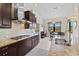 Modern kitchen showcasing granite countertops, stainless steel appliances and tile backsplash at 10816 O Meara Way, Englewood, FL 34223