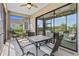 Inviting screened-in patio with comfortable seating, perfect for relaxing and enjoying the outdoors at 10816 O Meara Way, Englewood, FL 34223