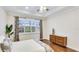 Spacious bedroom showcases hardwood floors, tray ceiling, and plantation shutters at 1358 Cielo Ct, North Venice, FL 34275