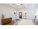 Well-lit bedroom with hardwood flooring and neutral walls offering a blank canvas for your personal touch at 1358 Cielo Ct, North Venice, FL 34275