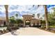 Community clubhouse featuring a tile roof, bicycle rack and well-maintained landscaping at 1358 Cielo Ct, North Venice, FL 34275