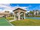 Charming gazebo with seating area by tennis court at 1358 Cielo Ct, North Venice, FL 34275