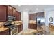 Kitchen with stainless appliances, granite counters, and abundant cabinetry at 1358 Cielo Ct, North Venice, FL 34275