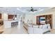 Open concept living space with kitchen, bar and entertainment center at 1358 Cielo Ct, North Venice, FL 34275
