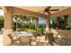 Outdoor patio with ceiling fan provides the perfect place to enjoy the tropical landscaping at 1358 Cielo Ct, North Venice, FL 34275