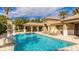 Resort-style pool with a covered lounge area and comfortable seating for community enjoyment at 1358 Cielo Ct, North Venice, FL 34275