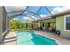 Inviting screened-in pool with brick paver patio and covered lanai, perfect for outdoor entertaining at 1358 Cielo Ct, North Venice, FL 34275