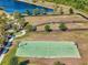 A high angle view of the community dog park next to the basketball court. The dog park features separate areas for large and small dogs at 14309 Carolina Sky Pl, Lakewood Ranch, FL 34211
