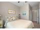 Bedroom features a ceiling fan and a bathroom ensuite at 14309 Carolina Sky Pl, Lakewood Ranch, FL 34211
