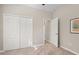 Carpeted bedroom with closet, overhead light and neutral paint at 14309 Carolina Sky Pl, Lakewood Ranch, FL 34211