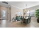Charming dining room with coastal decor, stylish light fixture and an inviting atmosphere at 14309 Carolina Sky Pl, Lakewood Ranch, FL 34211