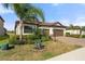 Charming single-story home with a tile roof, paver driveway, and well-manicured landscaping at 14309 Carolina Sky Pl, Lakewood Ranch, FL 34211