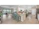 Spacious kitchen with stainless steel appliances, granite countertops, and a large island with bar seating at 14309 Carolina Sky Pl, Lakewood Ranch, FL 34211
