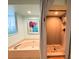 Bathroom with soaking tub, stone tiled shower and natural light at 1438 Vermouth Ln, Punta Gorda, FL 33983