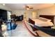 Large bedroom with wood-look floors, ceiling fan, hammock, work space and bed at 1438 Vermouth Ln, Punta Gorda, FL 33983