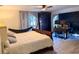 Spacious bedroom featuring a comfortable bed, hammock, and a dedicated desk area with dual monitors at 1438 Vermouth Ln, Punta Gorda, FL 33983