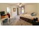 Cozy bedroom featuring a comfortable bed, workspace, and carpeted floor at 1438 Vermouth Ln, Punta Gorda, FL 33983