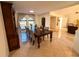 Elegant dining room featuring a large table, stylish chairs, and ample natural light at 1438 Vermouth Ln, Punta Gorda, FL 33983