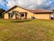 Home exterior featuring stucco, clay tile roof, and mature landscaping, enhancing the property's curb appeal at 1438 Vermouth Ln, Punta Gorda, FL 33983