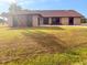 Charming exterior of home featuring stucco and stone, a clay tile roof, and a well-manicured lawn at 1438 Vermouth Ln, Punta Gorda, FL 33983