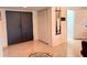 Hallway with large, double doors, closet and tile floor at 1438 Vermouth Ln, Punta Gorda, FL 33983
