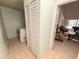 Convenient laundry room with washer and dryer, storage, and tile flooring near the living area at 1438 Vermouth Ln, Punta Gorda, FL 33983