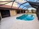Inviting in-ground pool with screened enclosure for pest control and privacy at 1438 Vermouth Ln, Punta Gorda, FL 33983