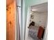 Bathroom shower with stone look, tile floor and view into a bedroom with bed and work space at 1438 Vermouth Ln, Punta Gorda, FL 33983