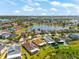 Aerial view showcasing the home's location in a residential community by a large lake at 1717 Bonita Bluff Ct, Ruskin, FL 33570