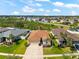Aerial view of a home in a residential community with lush surroundings at 1717 Bonita Bluff Ct, Ruskin, FL 33570