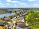 Aerial view of property in a residential neighborhood with a pond nearby at 1717 Bonita Bluff Ct, Ruskin, FL 33570