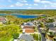 Aerial view of a single-Gathering home with scenic view and adjacent to beautiful pond at 1717 Bonita Bluff Ct, Ruskin, FL 33570