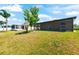 Spacious backyard featuring a screened lanai perfect for outdoor relaxation at 1717 Bonita Bluff Ct, Ruskin, FL 33570