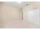 Neutral bedroom featuring a closet, neutral carpet and paint, and a doorway at 1717 Bonita Bluff Ct, Ruskin, FL 33570